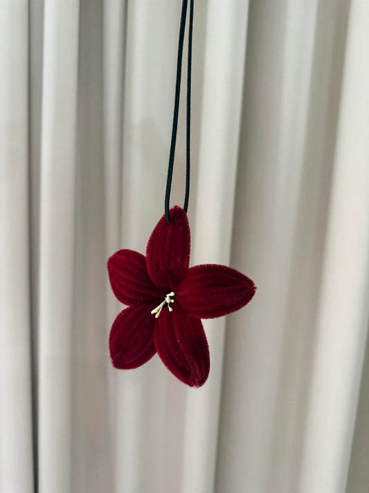 Maroon flower car accessorie